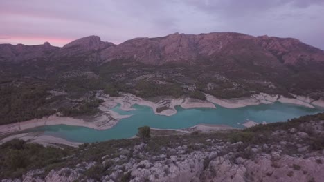 aerial view of reservoir and dam at guadalest at sunset - marina baixa, costa blanca, alicante, valencian community, spain