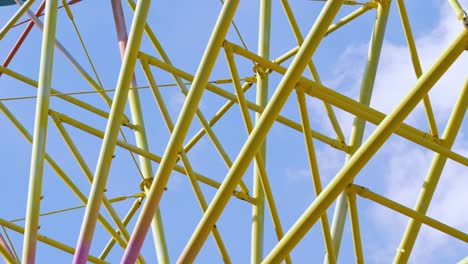 metallic multi-colored construction of a ferris wheel.