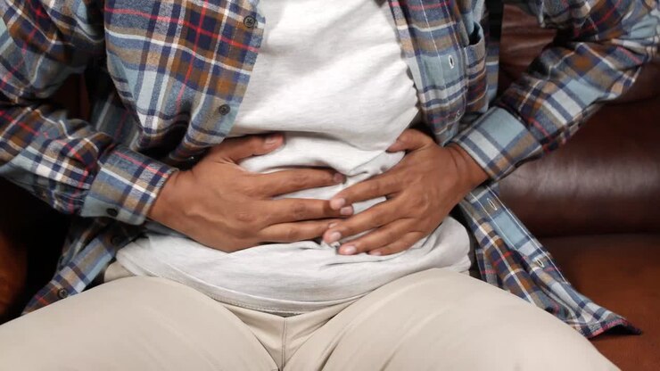 Man Experiencing Abdominal Pain
