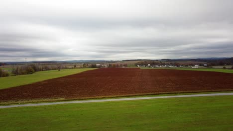aerial over a farm field in rural hamburg, pennsylvania