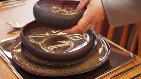 modern black dinnerware on a wooden table