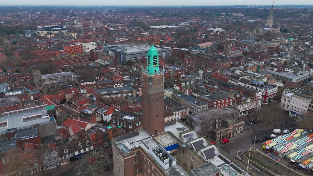Norwich in norfolk showcasing a historic tower and market square , aerial view