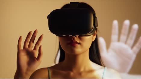 a woman explores a captivating virtual reality setup, interacting with digital elements around her while wearing a vr headset. the background features abstract visuals enhancing the experience.