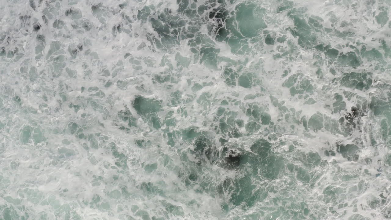 4K overhead of the ocean surface after a giant wave breaks