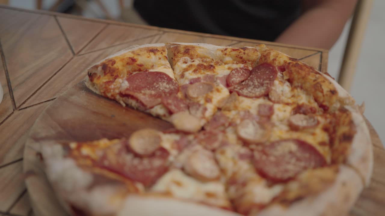 Person Eating a Pizza