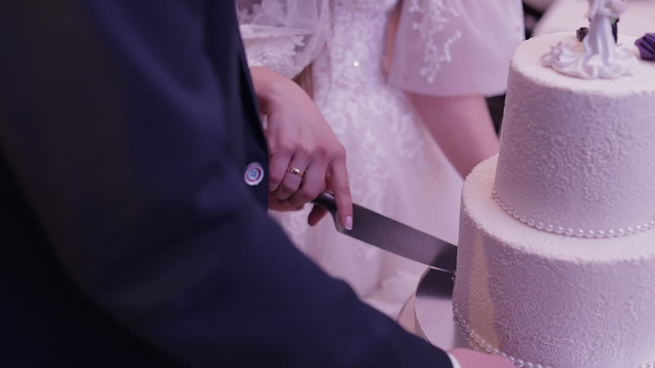Bride and Groom Cutting Wedding Cake