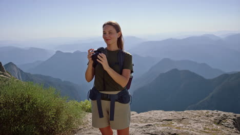 woman photographer captures scenic mountain views