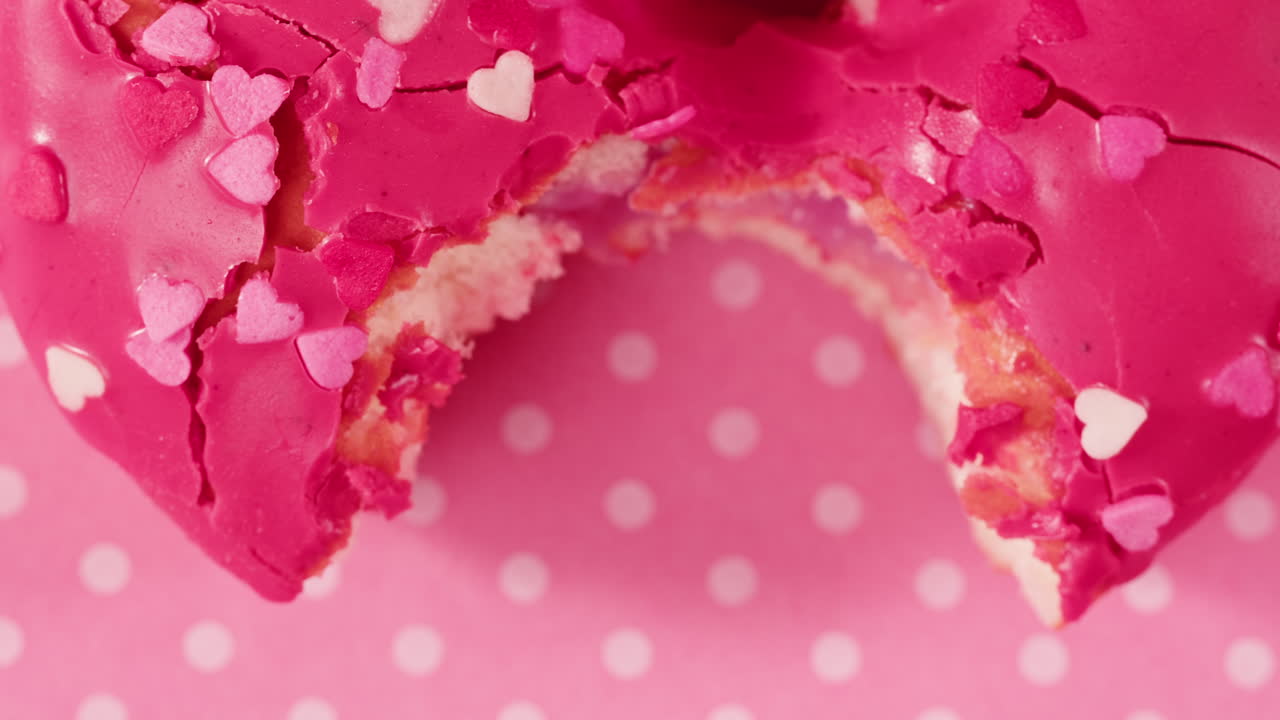 Pink Heart Donut with a Bite Taken Out