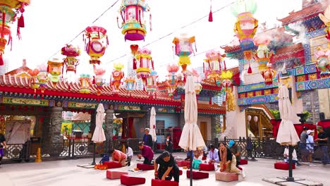 visitors engage in rituals at vibrant temple