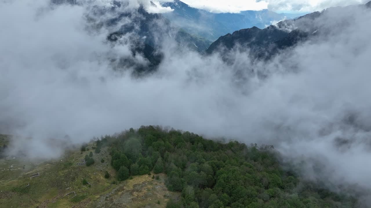 Cinematic tilt up inside clouds in the national park in Teth, Albania.