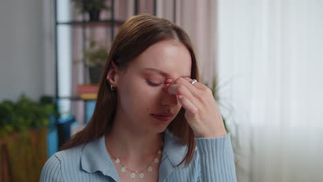 Close-up-portrait-of-tired-woman-teacher-suffering-from-tension,-migaine-headache-at-home-office