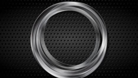 silver metallic ring on black perforated background video animation