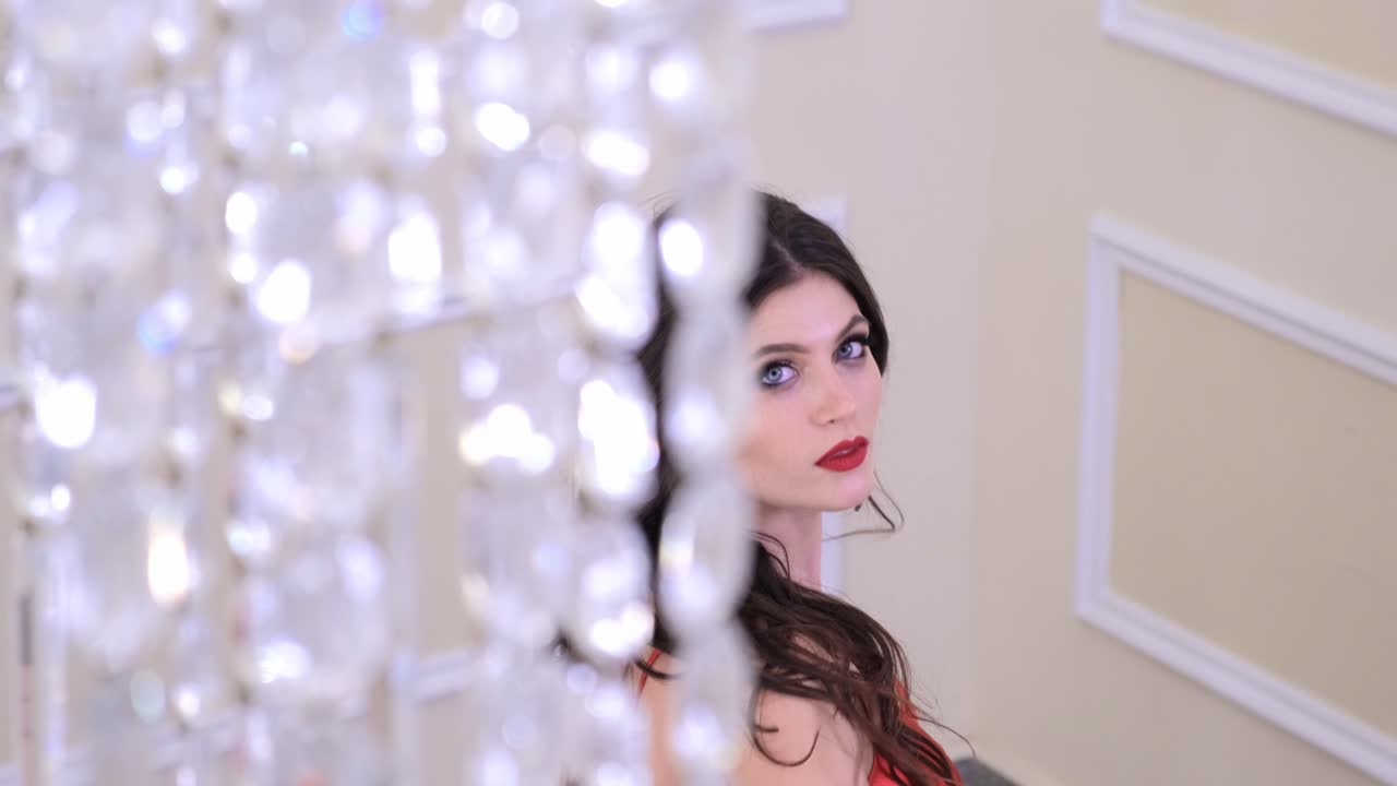 Woman in Red Dress with Crystal Chandelier