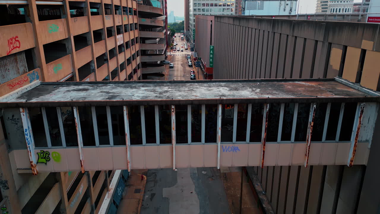 Saint Louis USA, 14 August 2025: Old abandoned multi-storied building in St. Louis, Missouri, USA. Drone footage at the rusty structure with graffiti and broken windows