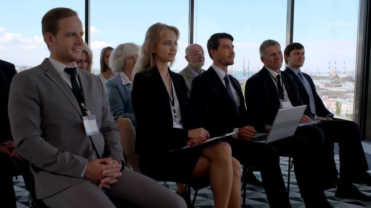 Business audience applaud at training