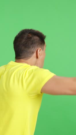 rear view of a man waving a ukrainian pennant