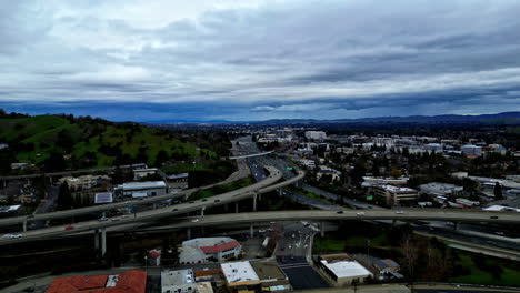 Aerial-view-of-city-scape,-urban-jungle-covered-by-thick-clouds,-cold-day-outside