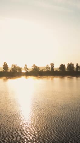 sunrise over a misty lake