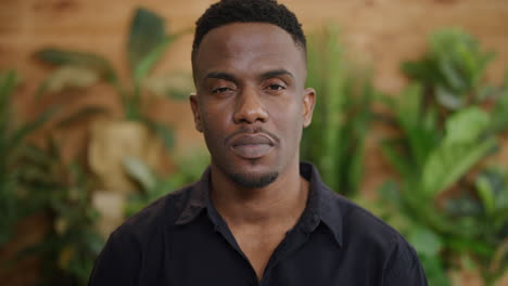 portrait of confident african american man looking serious at camera calm independent black male real people series