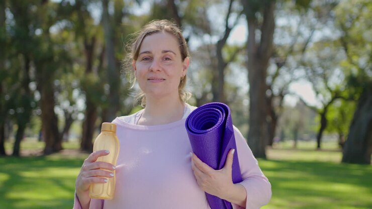 Woman on a yoga break in the park