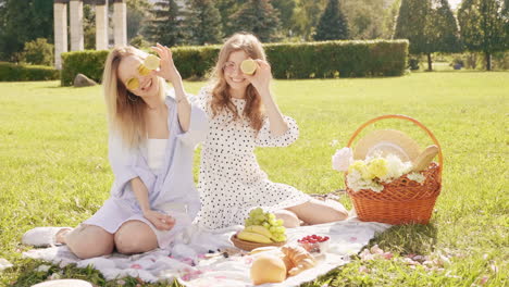 happy friends enjoying a picnic in the park