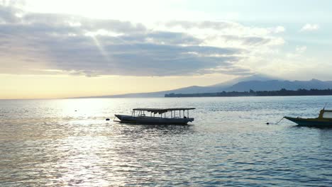 Ko-Samui-Island,-Thailand,-Silhouette-of-Boats-Floating-By-the-Sea-During-sunrise