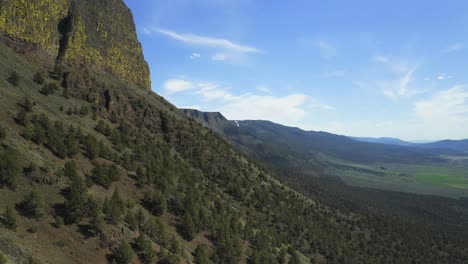 lush green slope of abert rim - majestic landmark in lake county, oregon with breathtaking scenery