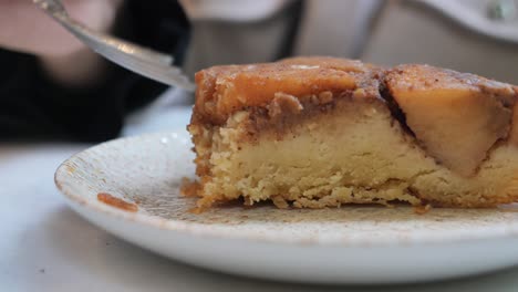 enjoying a slice of apple crumble cake