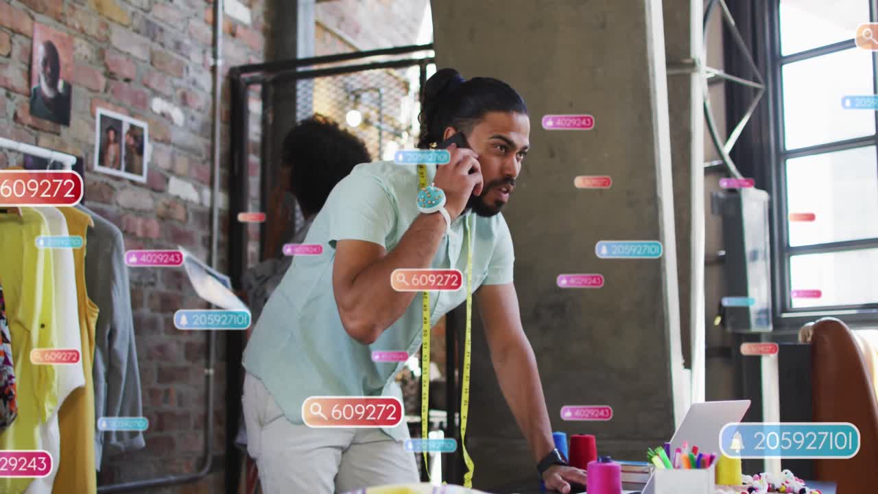 Animation of social media icons over biracial businessman