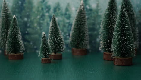 Christmas-holiday-scene-with-pine-trees,-snow,-reindeer-and-santa-claus-in-a-train,-stop-motion-animation
