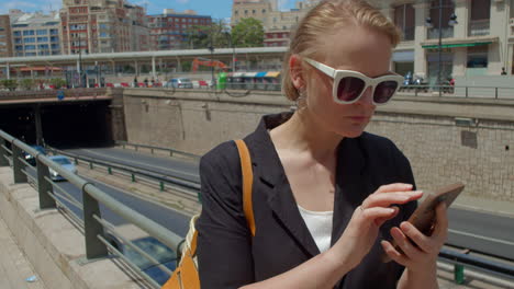 woman with a mobile phone on the street