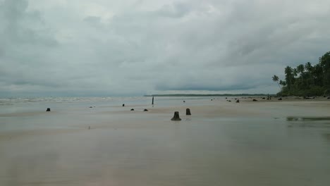 drone views of sempadi beach during monsoon season raining day asian tropical,sarawak,borneo