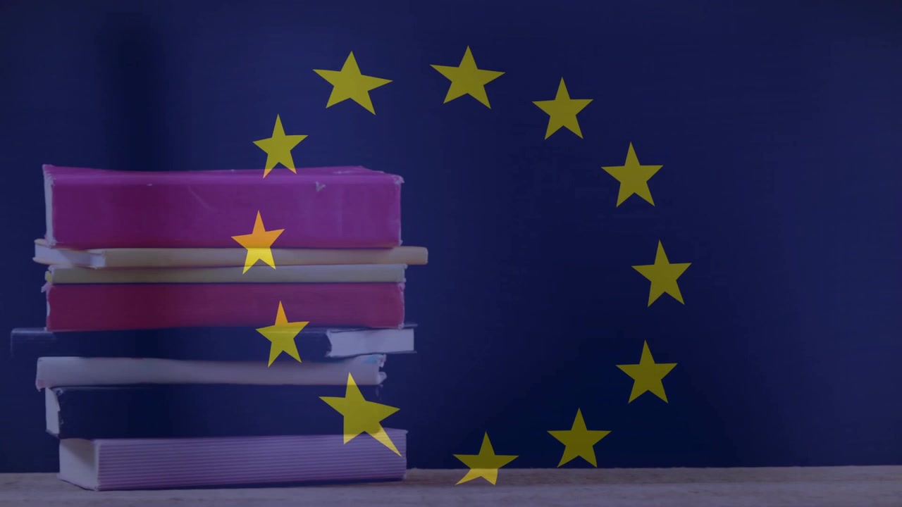 Formando un cerchio di dodici stelle che iniziano una rotazione in senso orario sopra cinque libri che mostrano l'unità dell'UE.