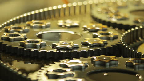 machine gears background. close up of cogs and gears. machine parts production