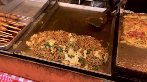 japanese street food stall selling okonomiyaki takoyaki potatoes fried chicken yakisoba