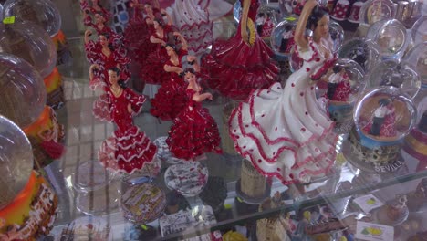 Souvenir-figurine-of-flamenco-dancer-women-in-tourist-shop-window-in-Spain