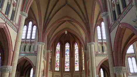 ceiling and stained-glass windows of old gouda church