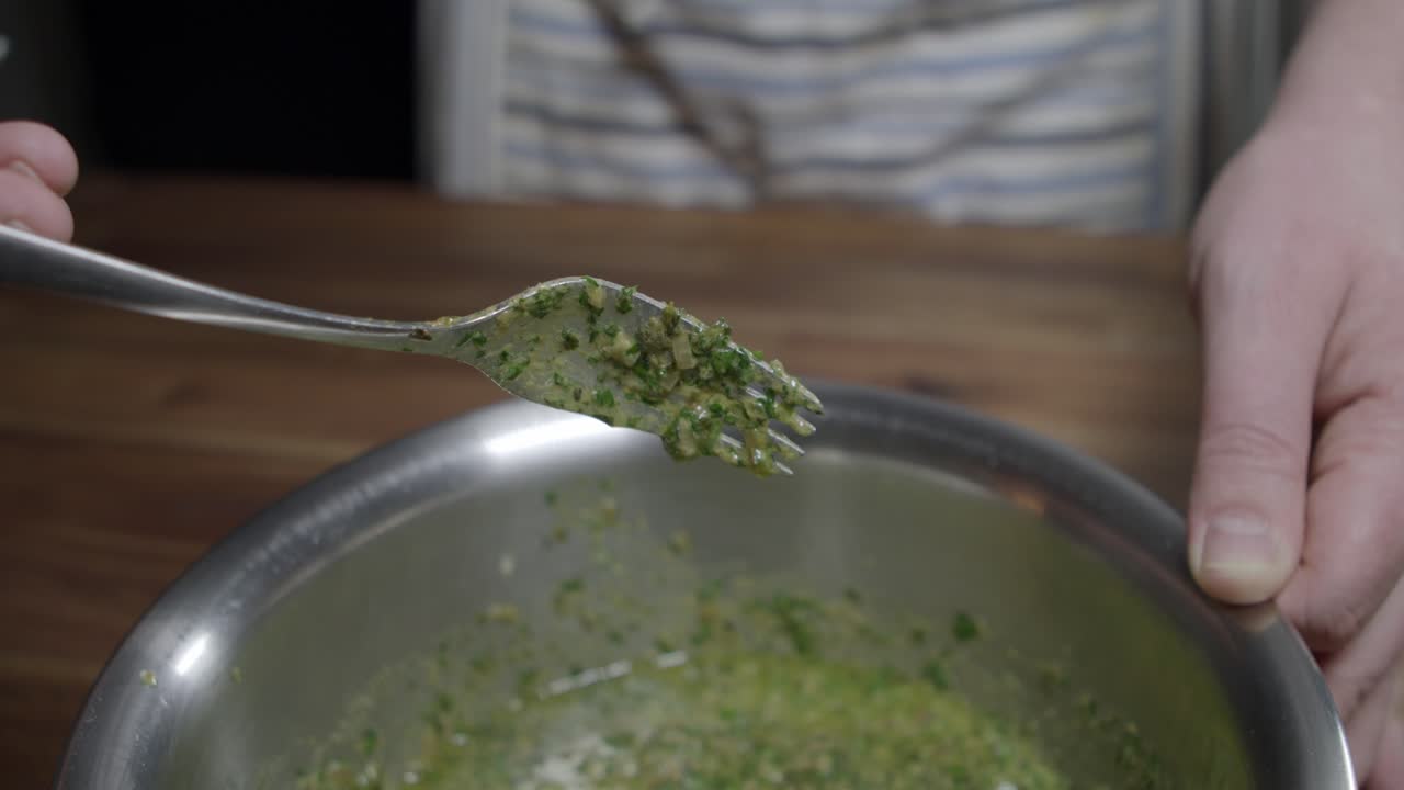 Delicious caf&eacute; de paris sauce is prepared by a chef