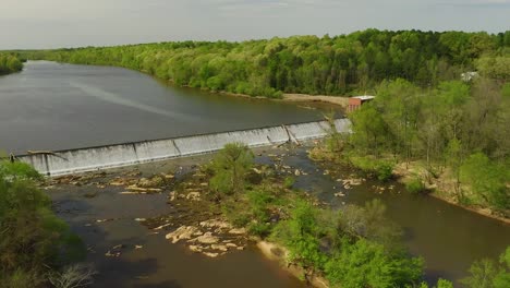 drone flyover over a river in north carolina with spillway