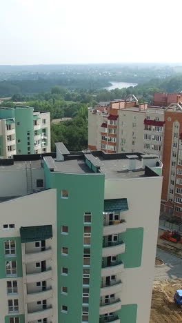 panoramic view of modern residential complex in the city. modern design of a multy-storeyed buildings in a new construction area. aerial view vertical video