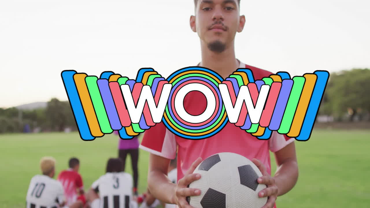 Soccer player holding ball with colorful WOW! text animation over teammates