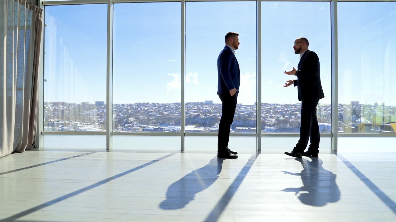 Businessman shadow near the window. Silhoutte of successful businessman.