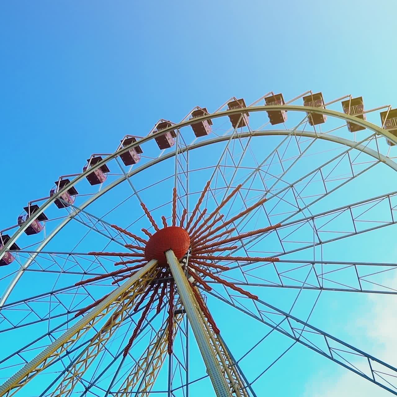 Ferris wheel over blue sky. Blue sky and sunny day in amusement park