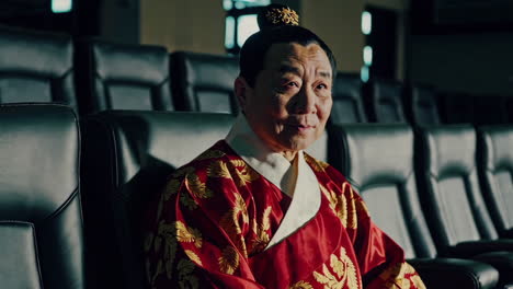 elderly man in traditional korean clothing at a movie theater