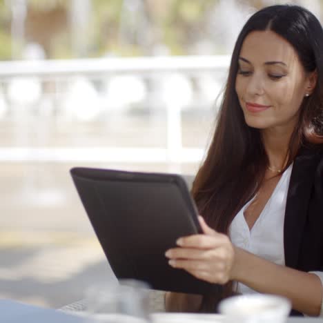 Pretty-businesswoman-working-on-a-tablet