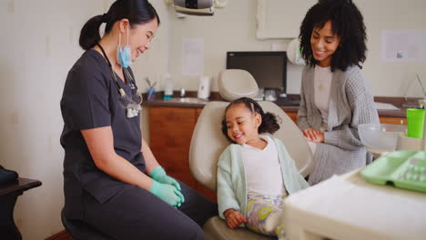 dentist and child giving fist bump during fun