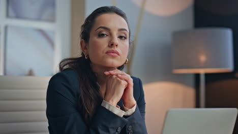 thoughtful office employee posing workplace looking camera thinking portrait