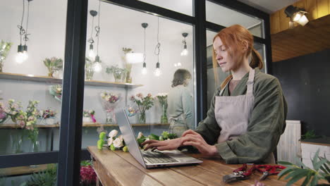 florists working in cozy flower shop