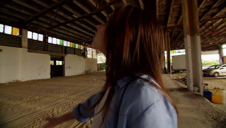 empty factory interior with person pointing