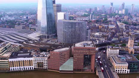 AERIAL---Overview-of-London-Bridge-train-station,-London,-England,-truck-right